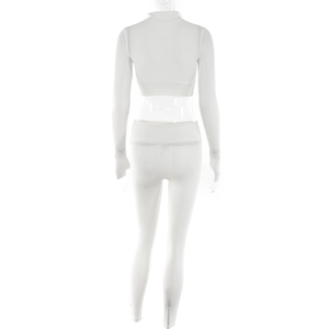 Rear view of white ribbed two-piece set featuring long sleeve crop top and leggings