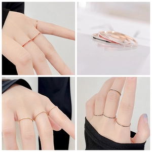Slim titanium rings in gold, black, red, and white finishes for minimalist stacking style