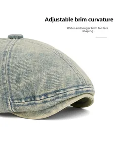 Detailed close-up of flexible wide brim on washed denim beret with vintage texture