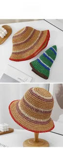 Detail of handmade striped straw bucket hats showing fine woven texture and color patterns