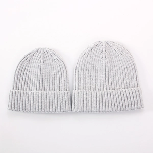Detail of light gray ribbed knit hats in adult and child sizes for parent-child matching