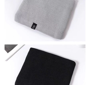 Detailed close-up showing texture of grey and black knit thermal winter neck warmers