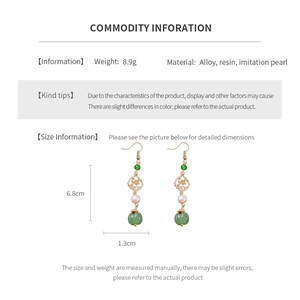 Detail view showing dimensions of vintage floral earrings with pearl and resin tassels