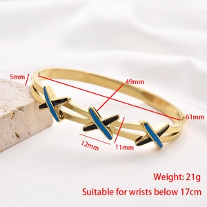 Detailed dimensions of the crossover gold stainless steel bangle with blue enamel
