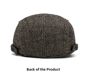 Back view of herringbone tweed newsboy cap with adjustable side straps and metal buckles