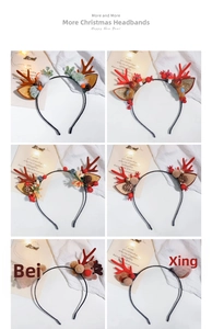 Close-up of Christmas antler headbands with plush balls, pine cones and berries decoration