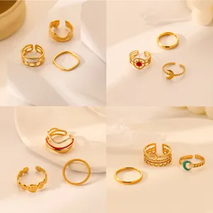 Detailed four-grid view of gold-plated ring sets with enamel stars and moon motifs