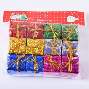 Close-up of 12 colorful Christmas gift box ornaments with shiny metallic finish and ribbons