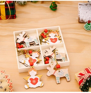Detail of wooden reindeer and angel Christmas ornaments in a four-compartment storage box