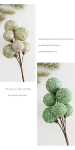 Close-up of glittering Christmas berry branches with champagne and green sequins