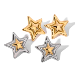 Set of two pairs of gold and silver five-pointed star stud earrings in minimalist metal style