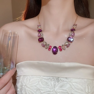 Detailed view of luxury geometric necklace set with sparkling oval rhinestones on model