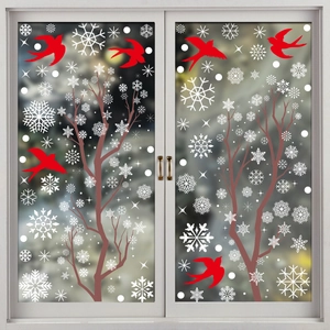 Christmas window stickers with red birds, snowflakes and winter trees on glass doors