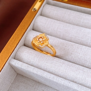 Detailed macro view of 24K gold plated flower ring featuring crystal pavé petals