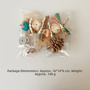 Parrot chewing toy set with natural wood and pine cones in clear packaging box