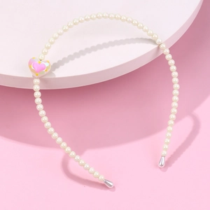 Elegant white pearl headband for girls with colorful heart accent and silver drop detail