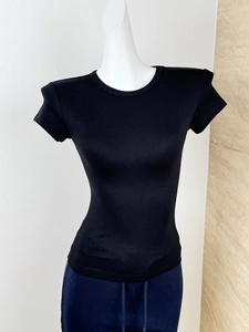 Close-up of black ribbed modal slim-fit T-shirt showing fine fabric texture on mannequin