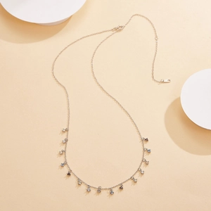 Detailed macro view of S925 silver necklace with sparkling colorful zircon tassel charms
