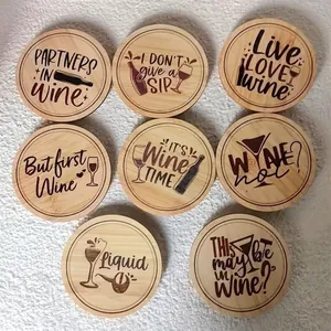 Set of 8 round wooden wine coasters with laser-engraved phrases for home table decor