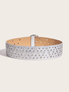 Close-up of wide PU leather belt with silver rivets and hollow metal rings detail