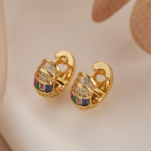 Gold huggie earrings with colorful gems and zirconia, featuring side heart cut-outs