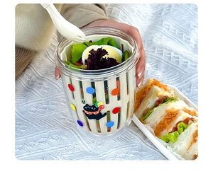 Close-up of double-layer salad cup with drainage basket and black cat sticker