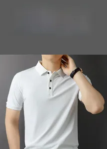 Detail of white short sleeve polo shirt showing classic collar and black buttons