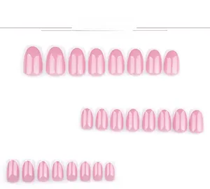 Detail view of pearlescent pink press on nails with classic white French tips design