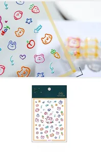 Macro detail of 3D embossed nail stickers featuring cute cartoon bears and rabbits