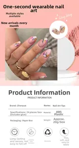 Detail showing elegant nude press-on nails with purple and yellow floral patterns