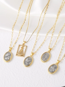 Detail of 18k gold bicolor Virgin Mary pendant necklaces with zirconia stone inlay