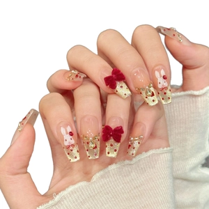Bowknot press-on nails with red velvet hearts and festive gold glitter cat-eye design