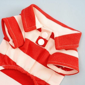 Detailed close-up of the red and white striped pet polo shirt collar with white resin buttons