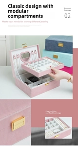 Detail view of multi-layer jewelry box with heart mirror and flexible storage sections.