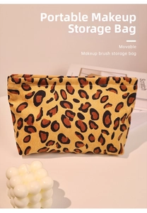 Detail showing vintage leopard print corduroy makeup bag with soft velvet texture