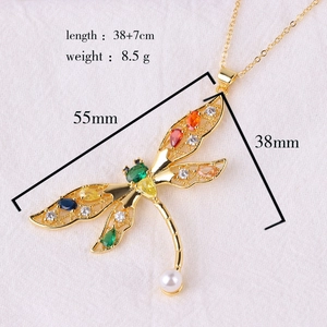 Detail showing dimensions of gold dragonfly pendant necklace with multicolor zircons