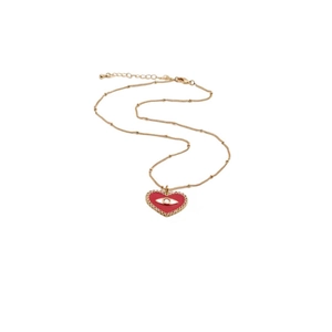 Gold chain necklace with red heart pendant and evil eye design on white background