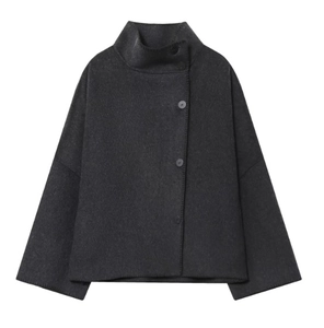 Detail of dark grey wool jacket with high neck collar and side button closure