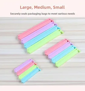 Macro view of multi-sized plastic food sealing clips in pastel colors on wooden surface