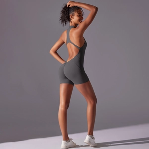 Rear view detail of high-stretch sports bodysuit with open back and peach lift cut