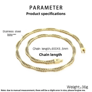 Macro detail of 6.5mm wide golden stainless steel curb chain with braided texture