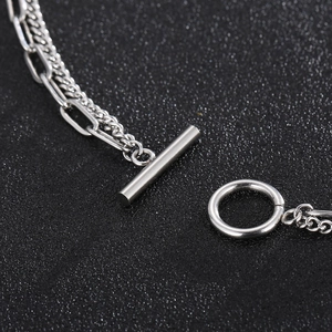 Detailed macro view of the silver titanium steel OT toggle clasp and chunky cuban links