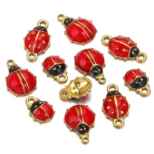 Detailed view of red ladybug charms with gold plating for DIY jewelry necklaces