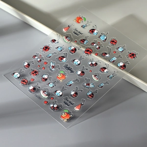 Detailed view of 5D cartoon ladybug and fruit nail art stickers with Co-251 model code