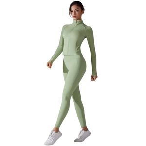 Sage green two-piece yoga set with slim fit long sleeve jacket and high waist leggings