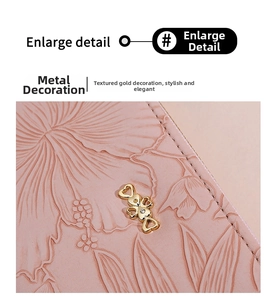 Close-up of pink embossed floral leather with a gold heart-shaped metal ornament