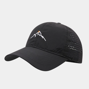 Close-up of black breathable mesh and mountain embroidery on water-resistant baseball cap