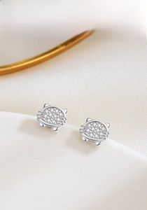 Close-up of S925 sterling silver cat stud earrings featuring micro-set white zircon stones