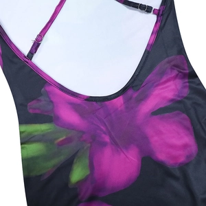 Close-up of floral print slim dress with adjustable thin straps and metal buckle details