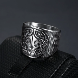 Vintage stainless steel Viking ring featuring an engraved face on a textured box
